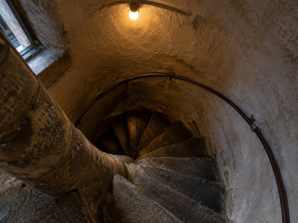 The spiral staircase down from a tenement stairwell